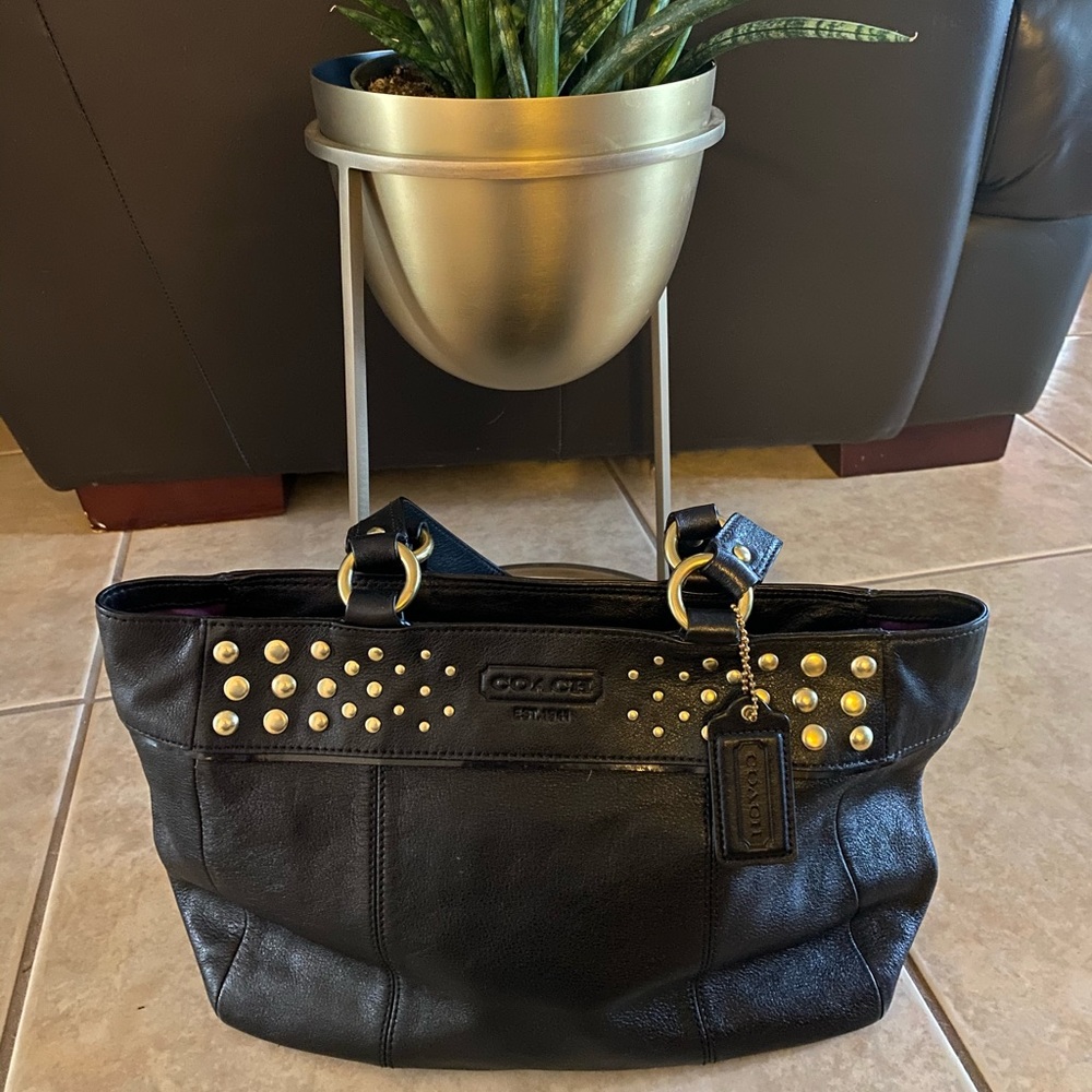 COACH black purse with gold accents, medium